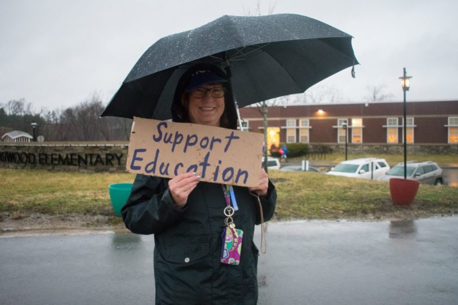5th Grade Teacher Karen Lemrey holds up her sign in support of the teachers protest.